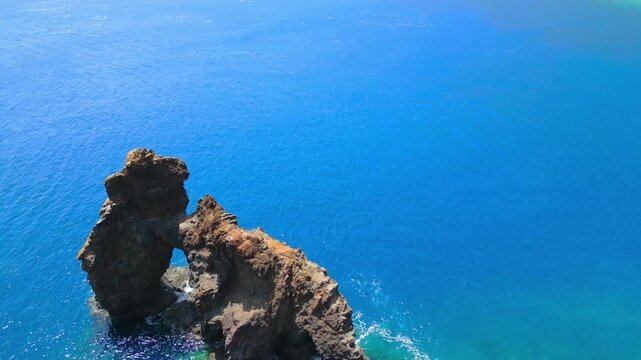 Roque de Bonanza is one of the symbols of El Hierro island and its natives. Huge Rock sticking out of the water on the las Almorranas beach. El Hierro, Canary islands, Spain, Europe	