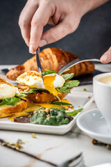 Delicious poached egg breakfast with fresh greens