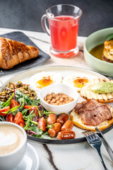 Hearty English breakfast with coffee and juice