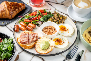Traditional English breakfast with eggs, beans, and bacon