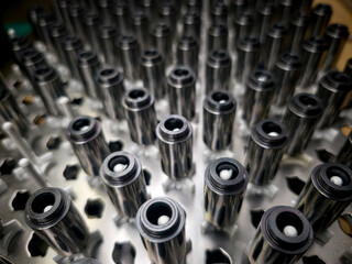 Close-up view of precision-engineered components arranged in a manufacturing facility during a quality control process
