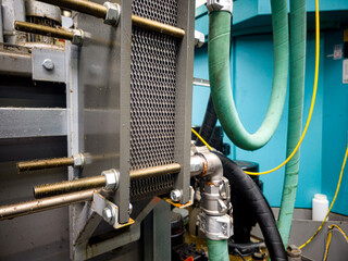 Industrial cooling system with pipes and metal components in a manufacturing facility