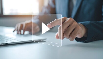 Glass play button icon touched by businessman hand representing digital technology concept