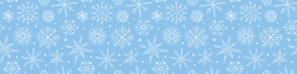 Vector seamless pattern from hand drawn snowflakes in doodle style. Winter, Christmas, new year blue background and texture. Snowfall, blizzard.