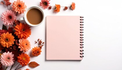 Floral arrangement featuring a cup of coffee and a blush-colored blank notebook on a white backdrop, ideal for content creation space