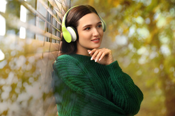 Woman listening to sounds of nature which making her feel calm. Double exposure of room and tree