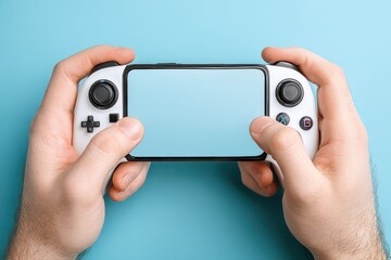 Hands holding a portable gaming console on a blue background
