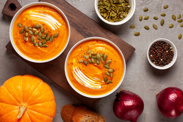 Pumpkin soup with seeds and spices close-up
