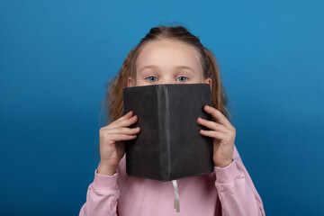 Curious Girl Reading Book