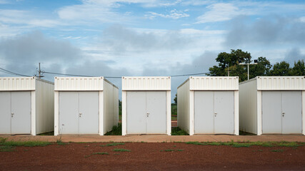 Switchgear control room that made from white container box with a safety door at the refinery industrial plant. Industrail object photo.