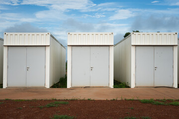 Switchgear control room that made from white container box with a safety door at the refinery industrial plant. Industrail object photo.