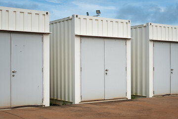 Switchgear control room that made from white container box with a safety door at the refinery industrial plant. Industrail object photo.