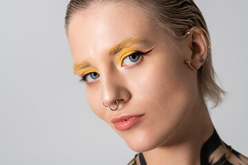 Captivating portrait of a young woman embracing modern fashion and artistic expression indoors