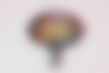 Brightly colored balloon floats against a soft, ethereal background