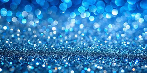 Abstract blue glitter bokeh background with soft focus lights