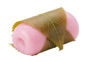 A vibrant pink mochi, wrapped in dried autumn leaves, against a black background.