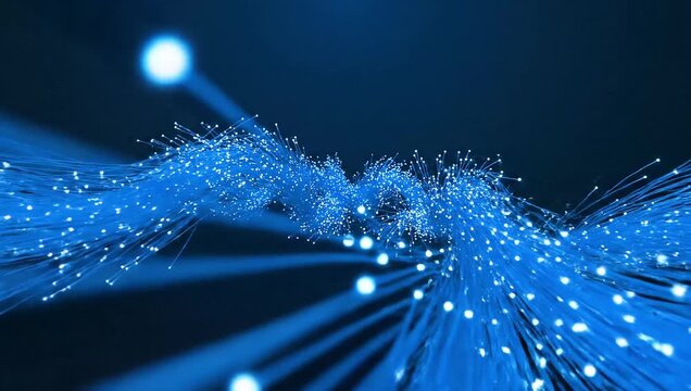 Close-up of glowing blue fiber optic cables against a dark background