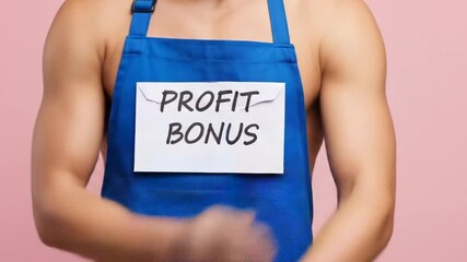 Charming Man with Profit Bonus, Smiling at the Camera, Apron-clad Model with a Promising Business Message