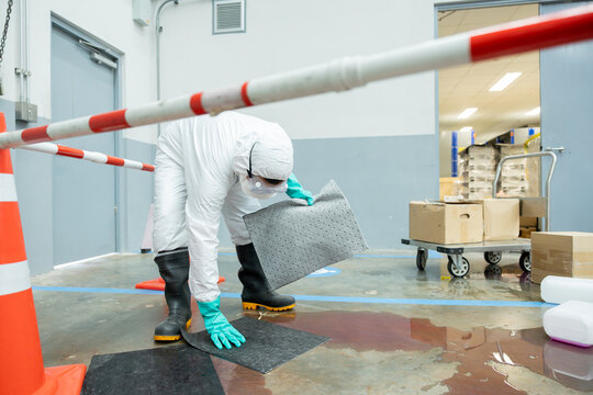 people cleaning chemical leak absorbent