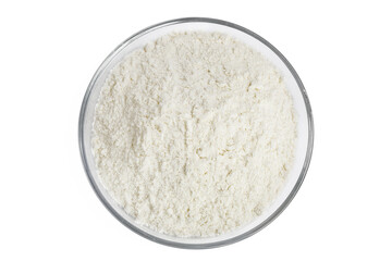 White flour in glass bowl isolated on white background. Top view. Flat lay.
