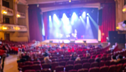 Audience enjoying live performance in blur concert hall