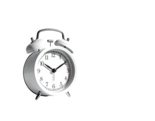 A small, white, classic-style twin-bell alarm clock, angled slightly to the right, displays the time against a black background.  The clock's hands point to approximately 355