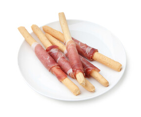 Delicious grissini sticks with prosciutto isolated on white