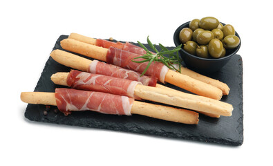 Delicious grissini sticks with prosciutto, green olives and rosemary isolated on white