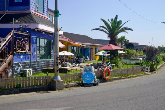 Cafe Row with Palms and Signs