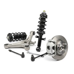 Automotive suspension components including shock absorber, control arm, brake disc, and ball joints arranged on a clean surface, showcasing essential parts for vehicle performance