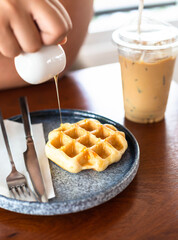 Honey flowing down to the waffle What a delicious meal