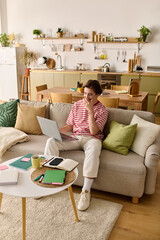 Young man engages in online learning at his modern apartment