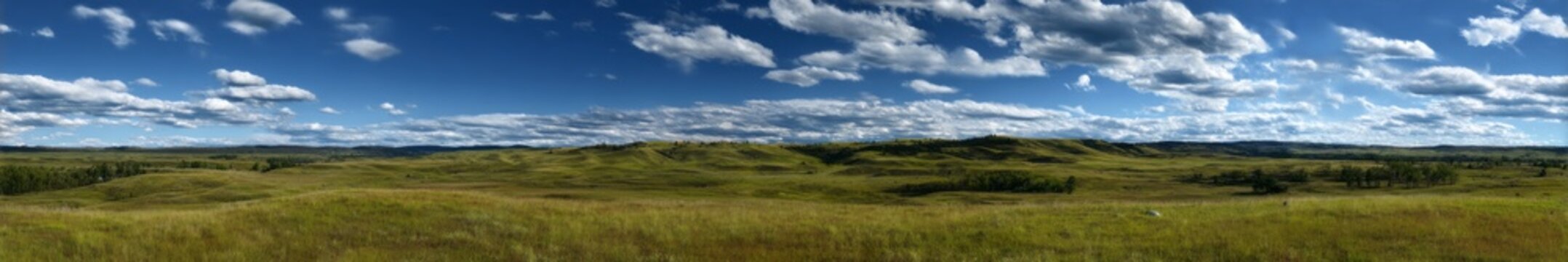 Panoramic hdr landscape view of rolling hills and clouds in nature