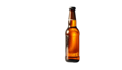 A single, amber-colored beer bottle with condensation, set against a stark black background; the bottle is partially illuminated