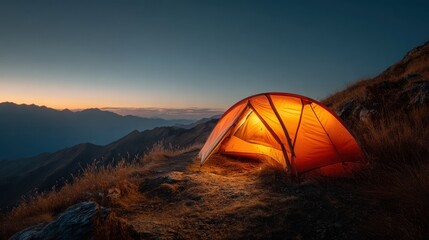 Illuminated tent at dusk atop a mountain peak offering a serene camping experience