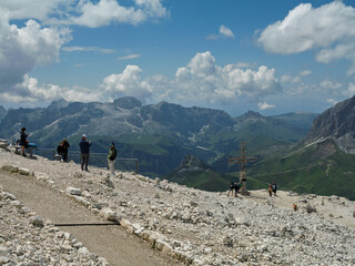 Tourists Admire The Panoramic View Of The Dolomites on a Summer day, Italy