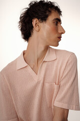 Obraz premium Stylish man showcasing elegant attire with a modern twist in a minimalist setting