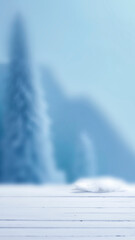Winter landscape with fresh white snow and copy space for product placement or text. Blurred  snow-covered trees and cloudy winter sky background.