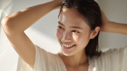 Fototapeta premium ヘアケアする女性【美容広告】