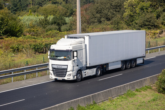 White daf refrigerated truck driving on highway