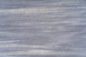 Smooth marble surface features subtle gray veining and a natural texture, perfect for background applications, enhancing elegance and sophistication in various design and architecture projects
