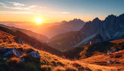 A breathtaking sunrise bathes a mountain range in golden light. The rolling hills meet jagged peaks, creating a serene vista