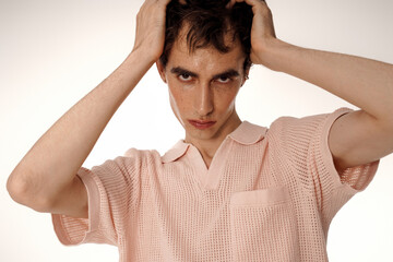 Handsome man effortlessly showcases elegance in stylish attire with a confident expression