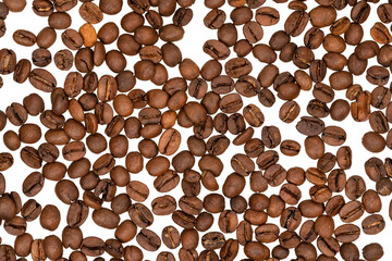Freshly roasted coffee beans isolated on white background. coffee texture close-up, top view.