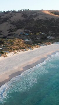 Vertical drone view of Snelling Beach on Kangaroo Island with hills and turquoise water, South Australia