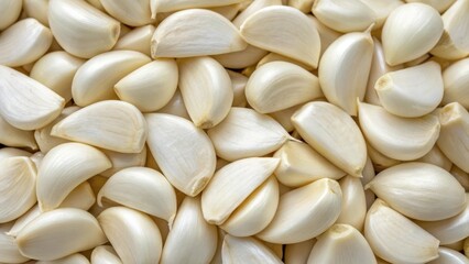 Close-up overhead view of peeled garlic cloves a healthy culinary ingredient for cooking and flavor