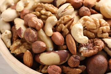 Mix of different nuts in bowl, closeup