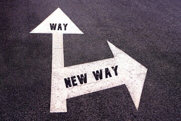 way and new way concepts. words written on a road sign with two arrows indicating different routes