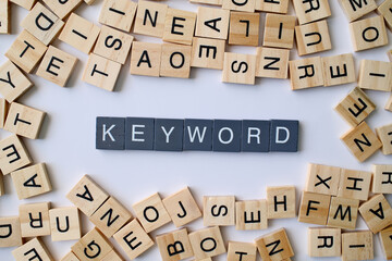 Keyword word in wooden cube blocks, search engine optimization concept, important term for marketing, digital strategy idea