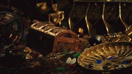 A collection of ancient artifacts lies scattered, showcasing gold coins, ornate jewelry, and a weathered chest. They hint at adventures and secrets waiting to be uncovered.